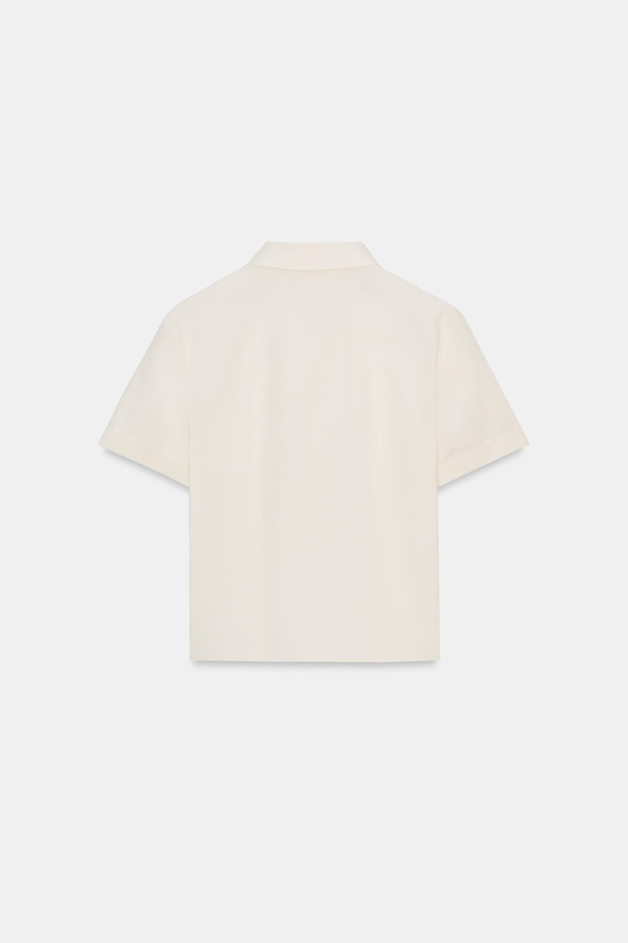 CHEMISE EN POPELINE À VOLANTS ET CLOUS